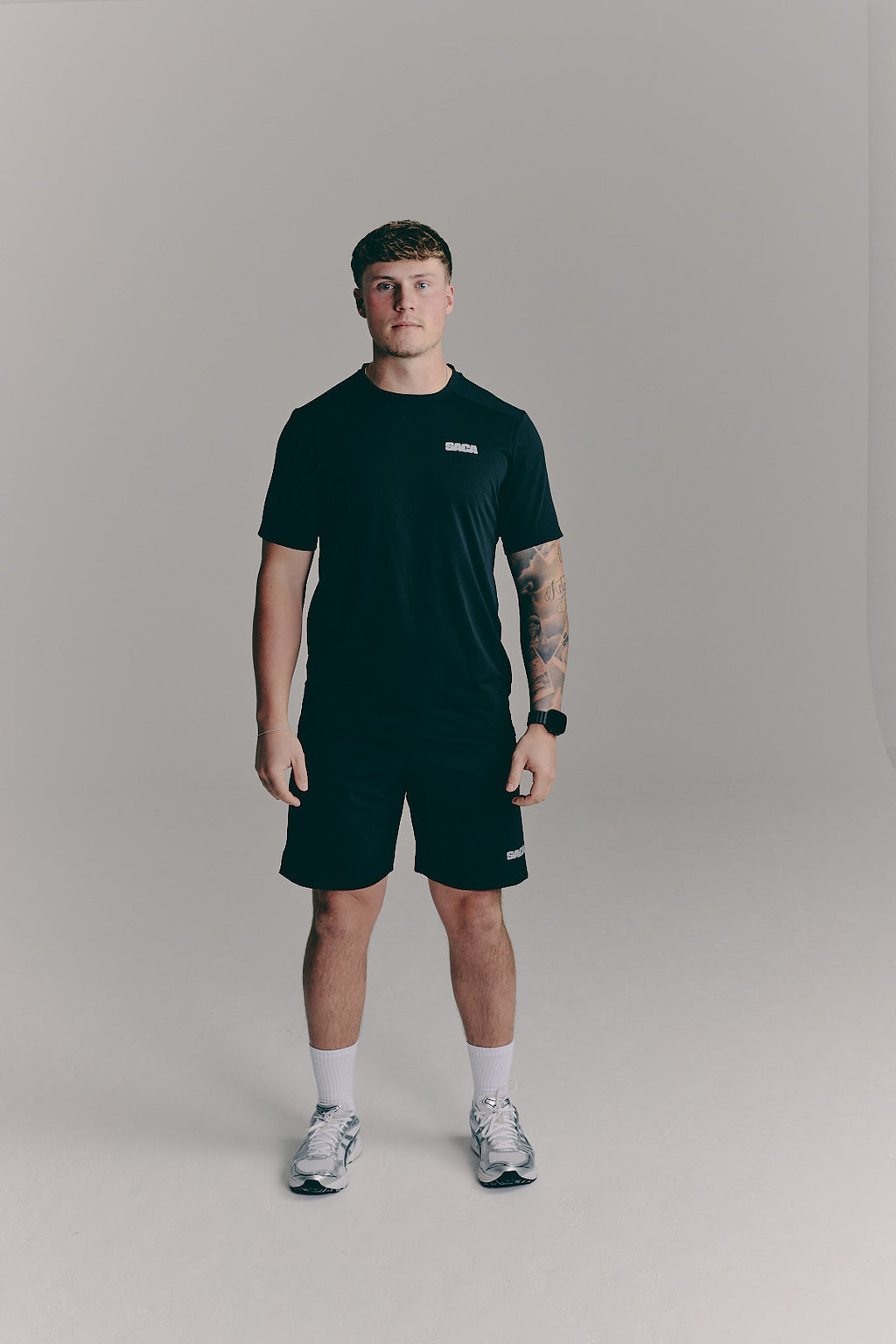 SACA Essential Shorts in black — front view worn by model