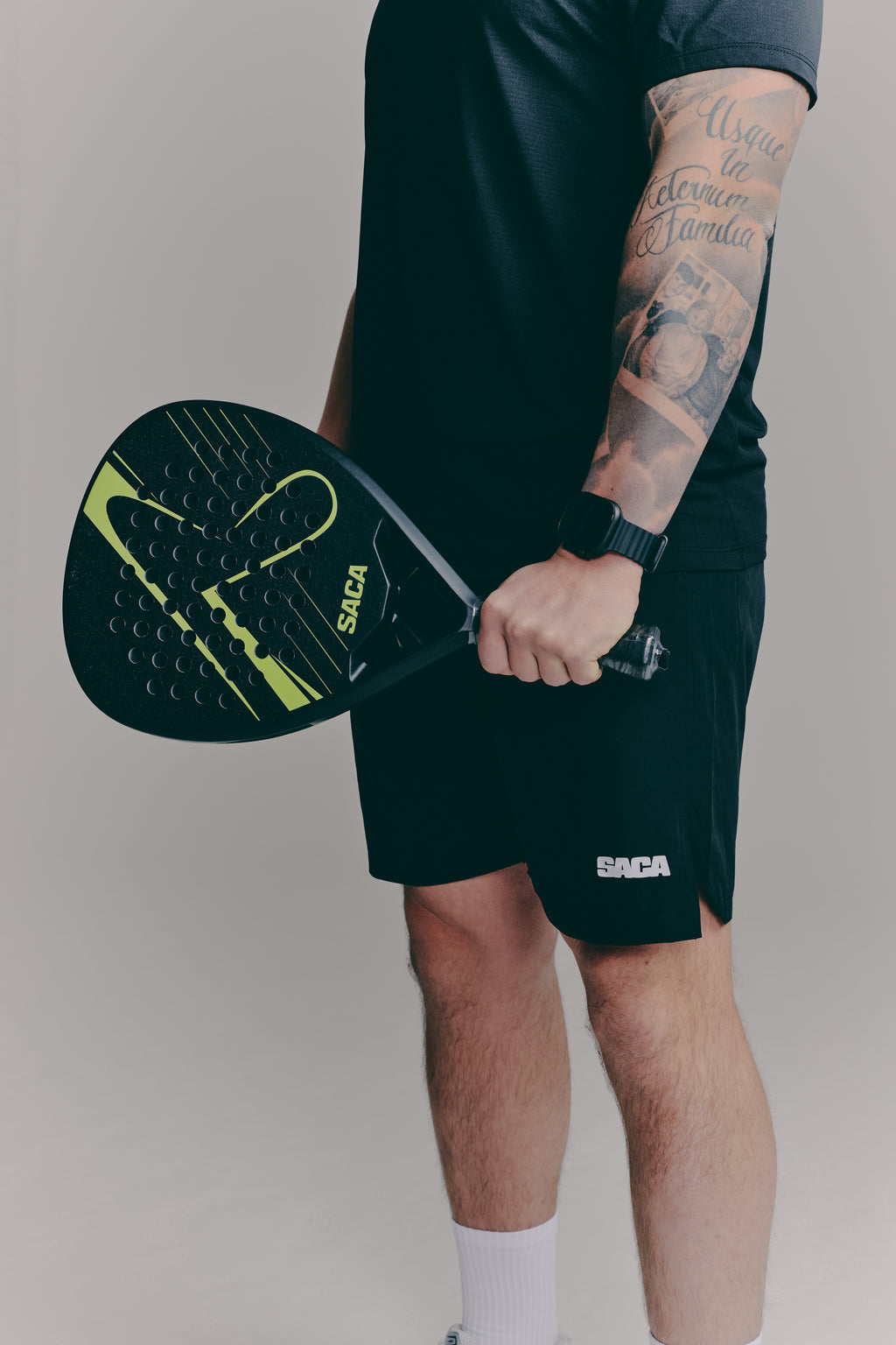 SACA Essential Shorts in black — back view worn by model