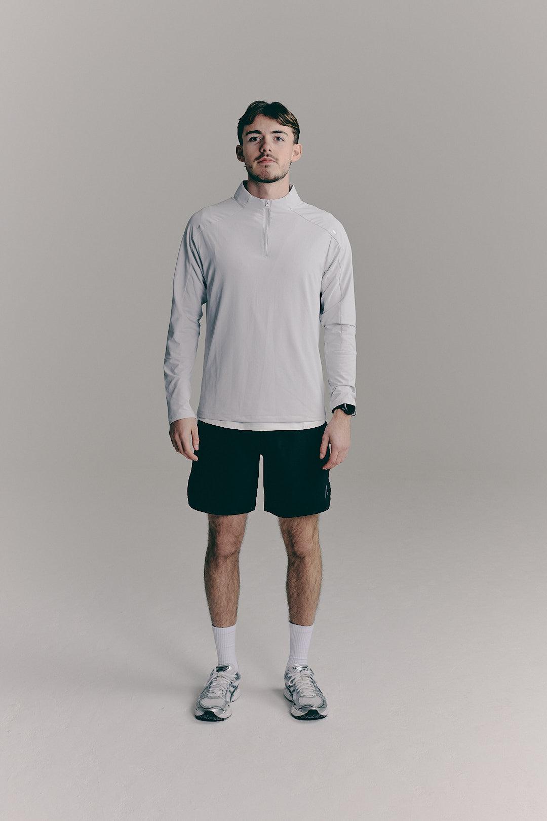 SACA Velo Quarter Zip in grey — front view worn by model