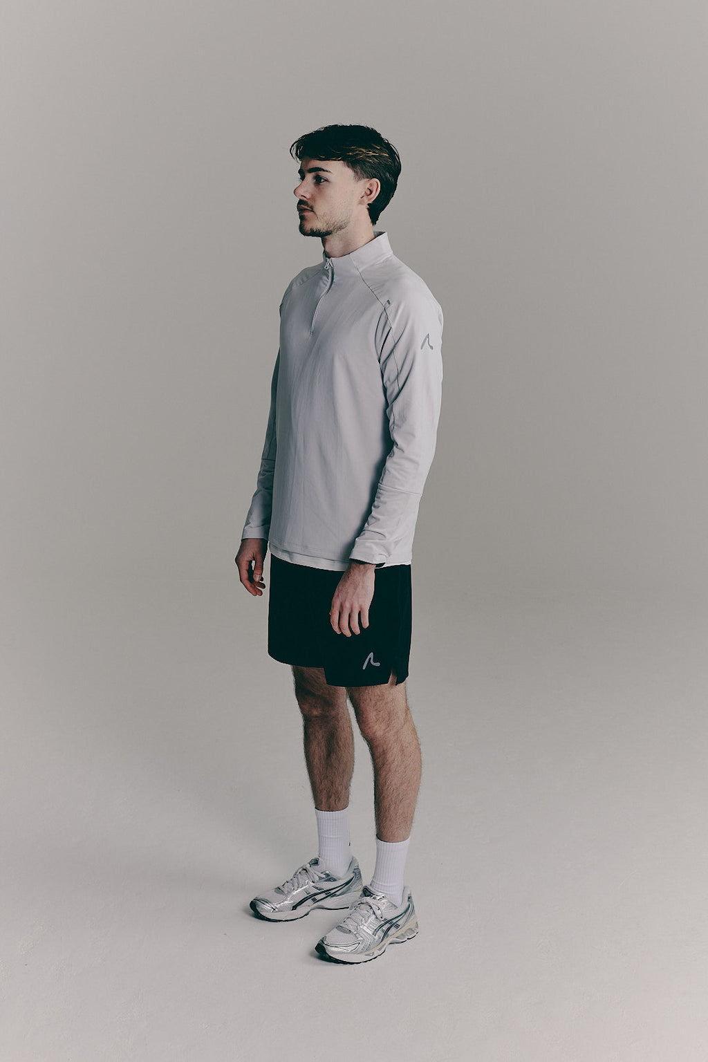 SACA Velo Quarter Zip in grey — side view worn by model