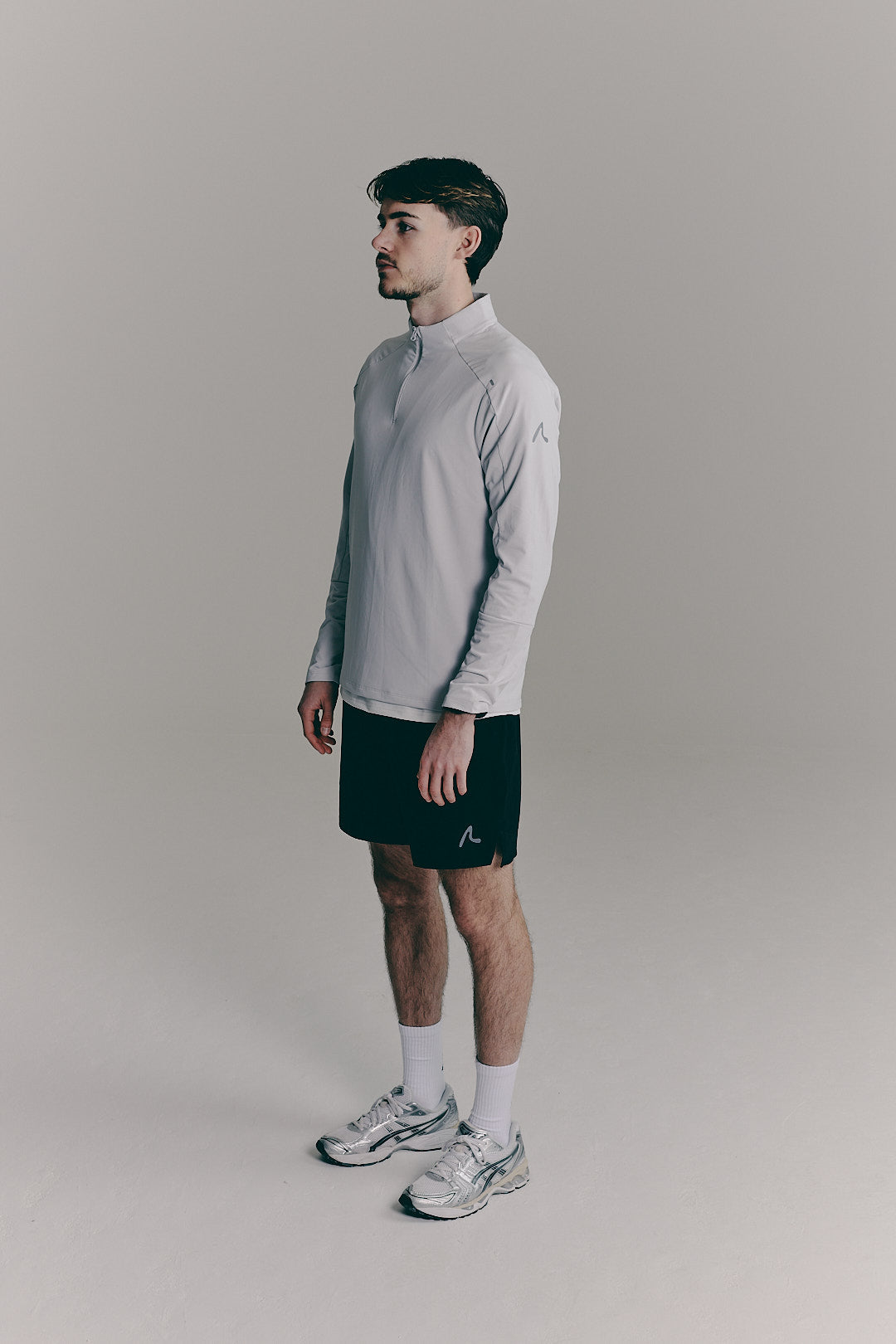 SACA Velo Quarter Zip in grey — side view worn by model