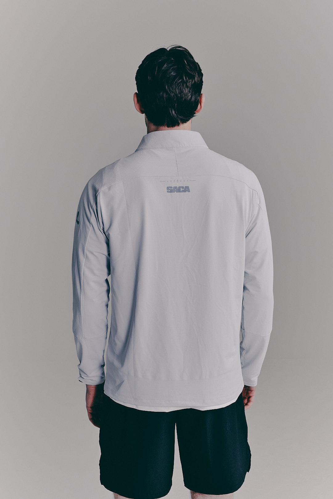 SACA Velo Quarter Zip in grey — back view worn by model