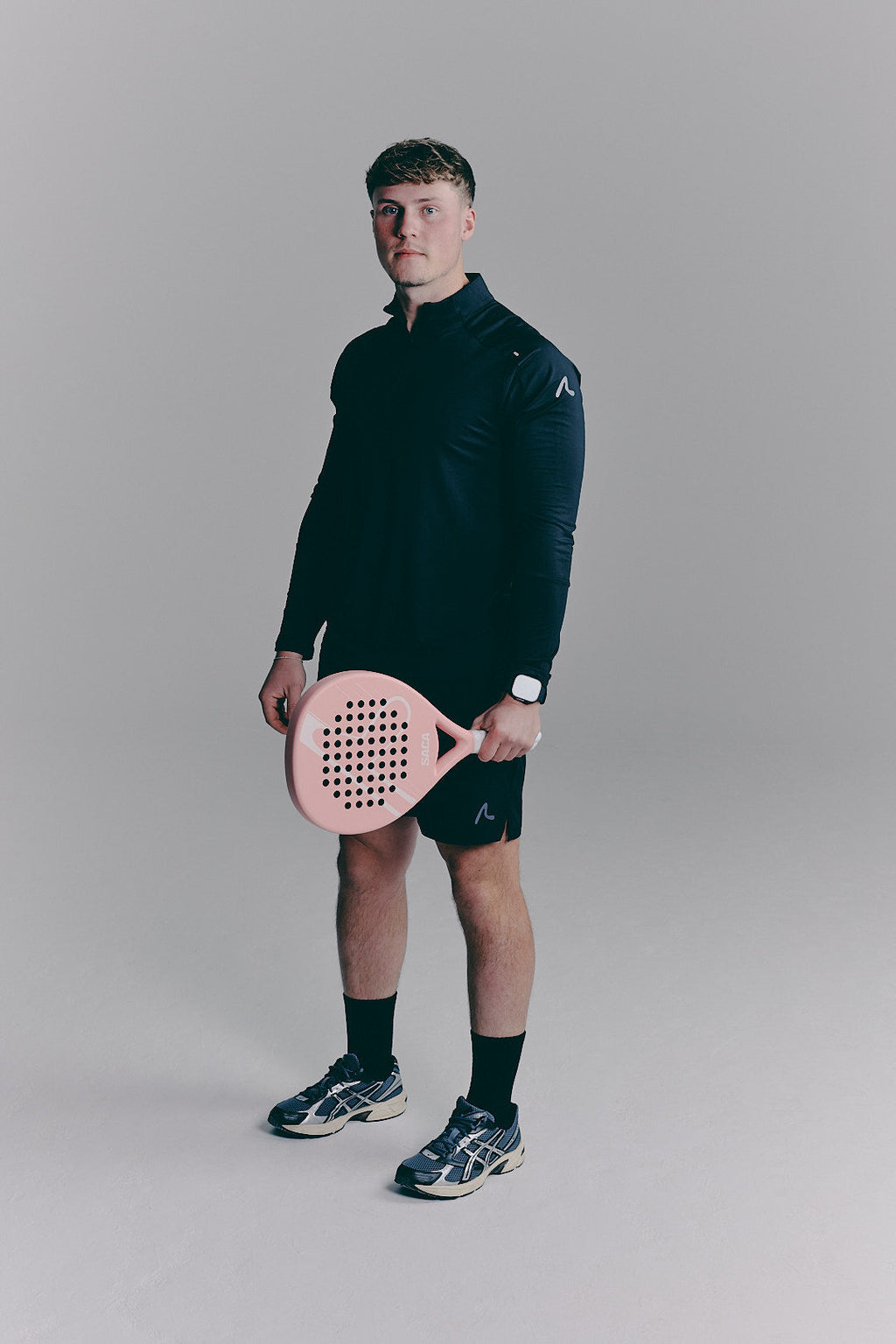 SACA Velo Quarter Zip in black — back view worn by model
