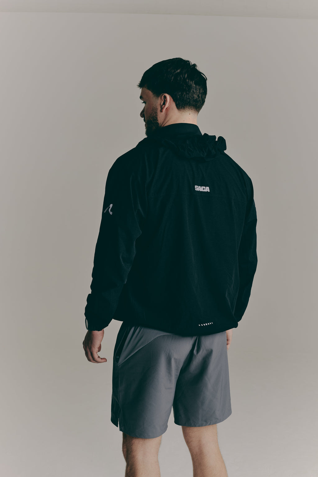 SACA Contest Shorts in grey — side view worn by model