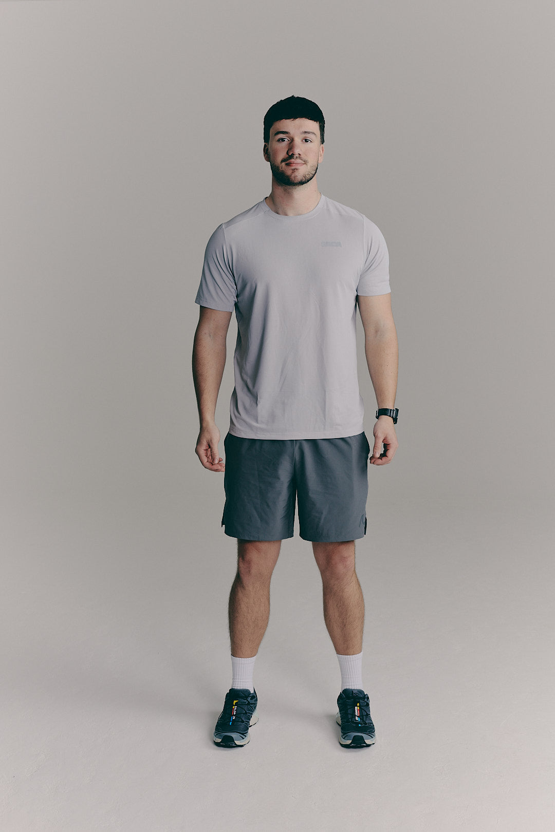 SACA Essential Tee in grey — front view worn by model