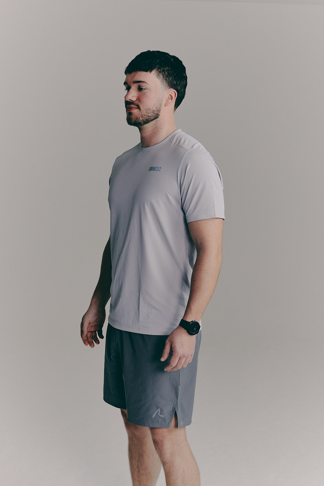 SACA Essential Tee in grey — back view worn by model