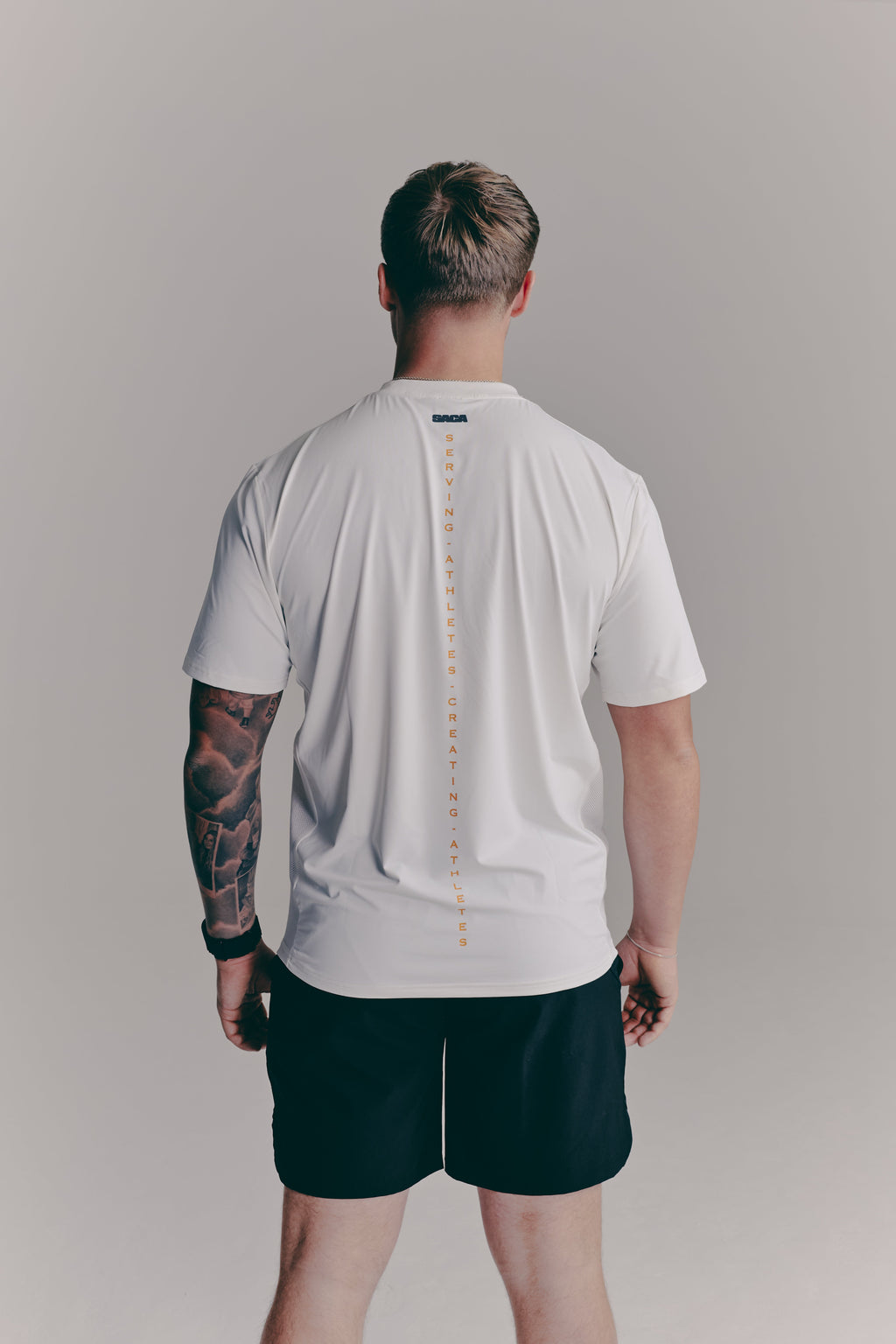 SACA Contest T-Shirt in white — back view worn by model